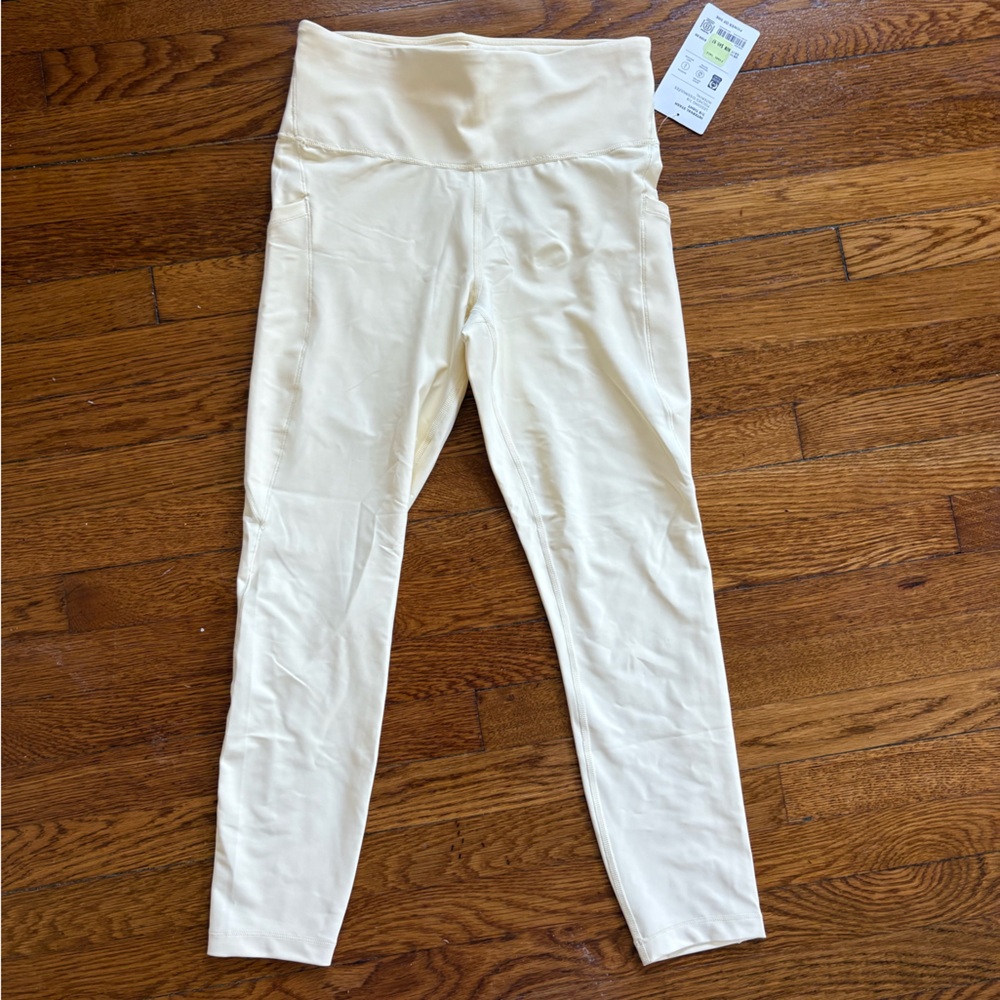 NWT Athleta interval stash legging in glow (yellow)